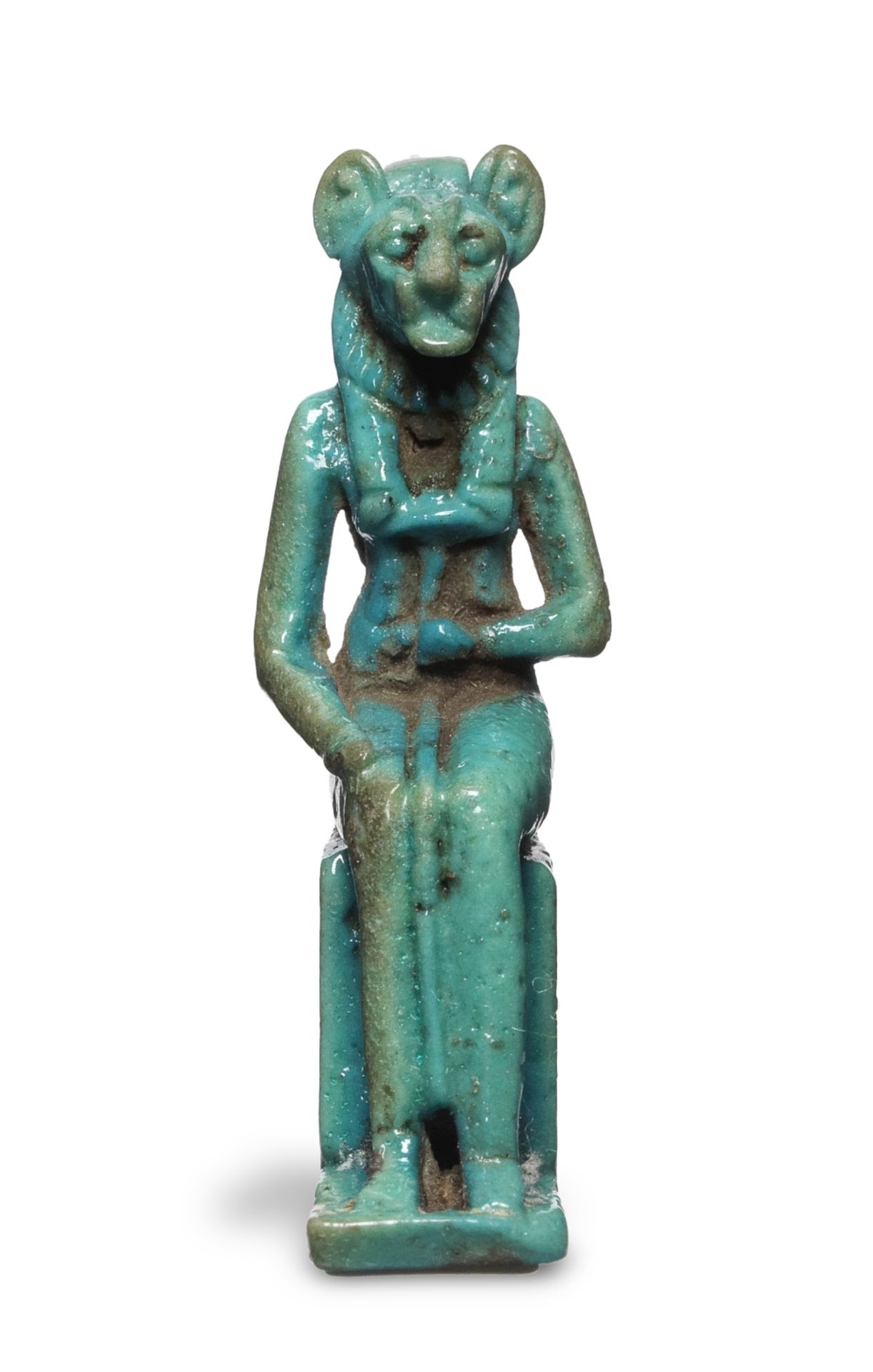 An Egyptian turquoise glazed faience amulet of a lion-headed goddess