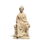 A Greek terracotta seated lady of fashion