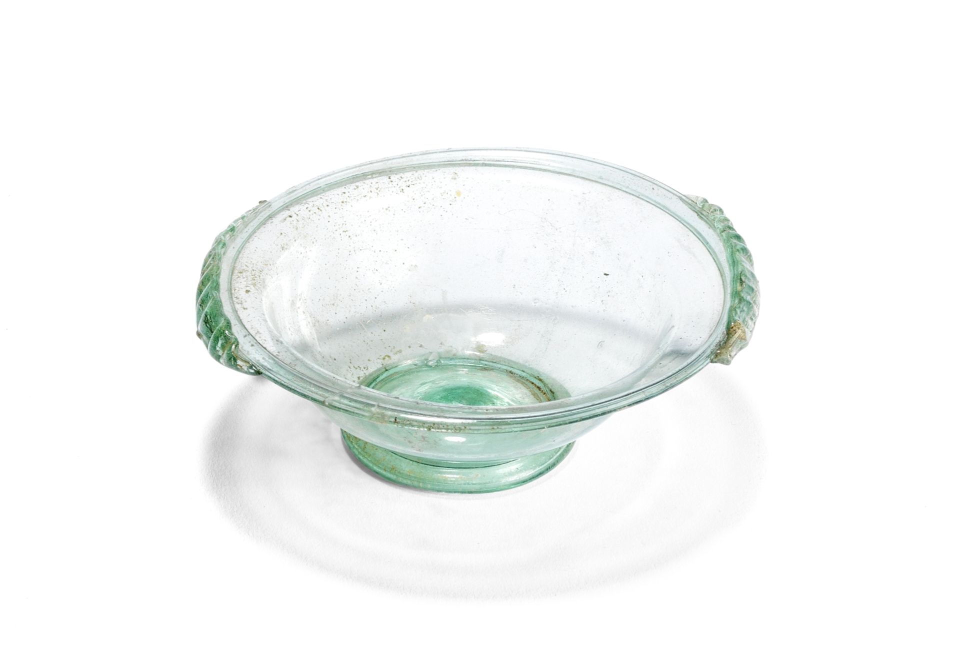 A Roman pale green glass bowl