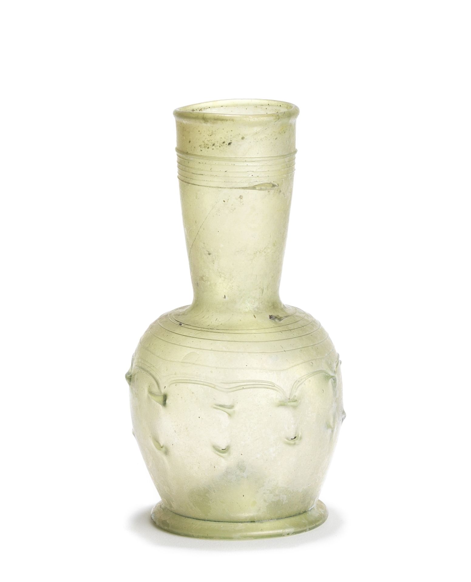 A late Roman - early Byzantine pale olive green glass flask with pincered decoration