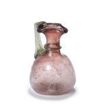A Roman streaky aubergine glass jug