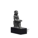 An Egyptian black steatite figure of Imhotep