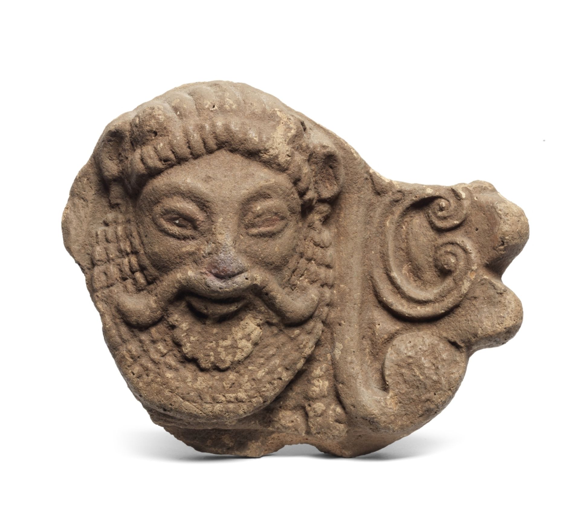 A fragmentary Etruscan terracotta antefix