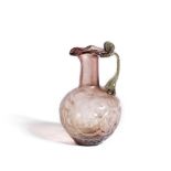 A Roman pale purple glass jug