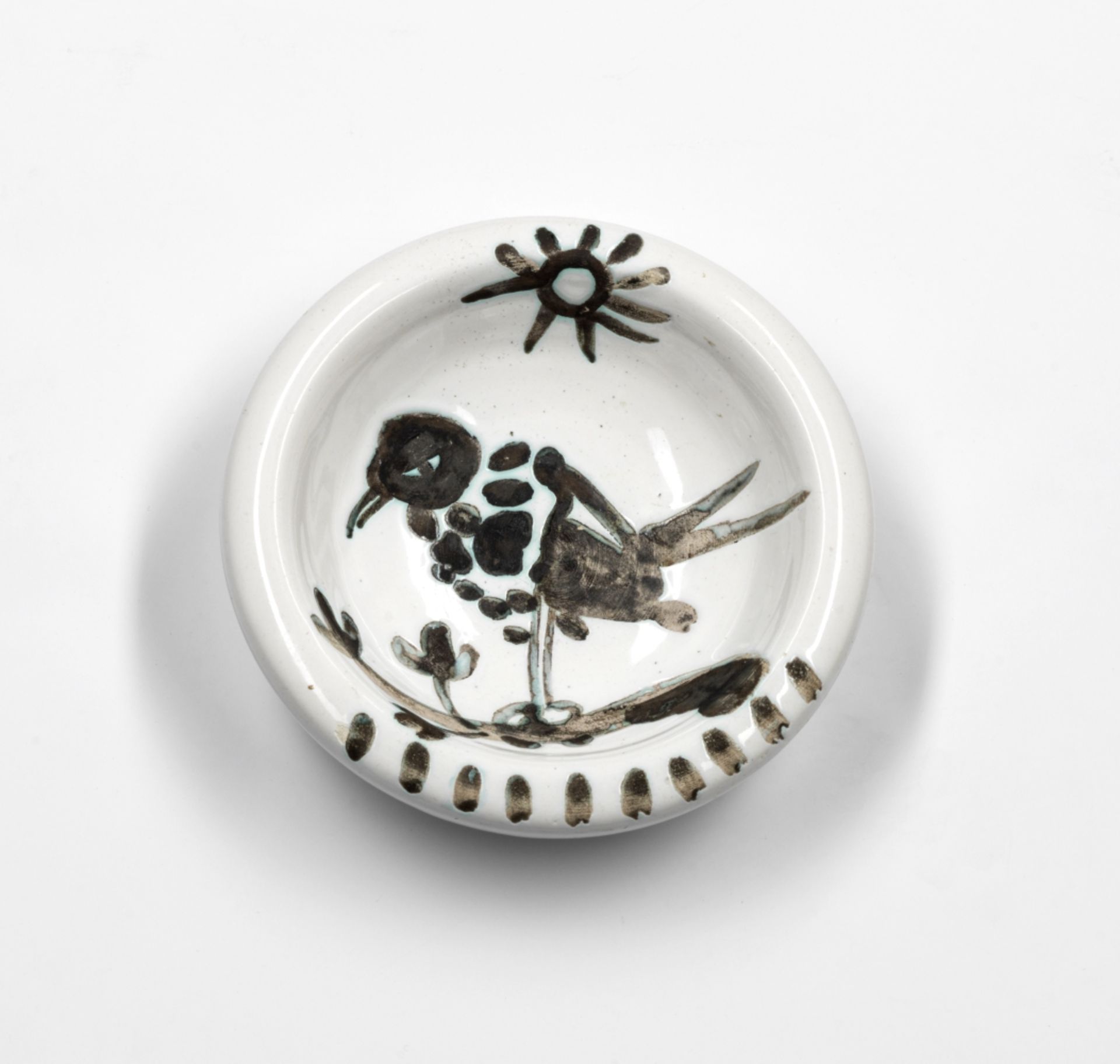 Pablo Picasso (Spanish, 1881-1973) Oiseau au Soleil White earthenware ceramic ashtray with black ...