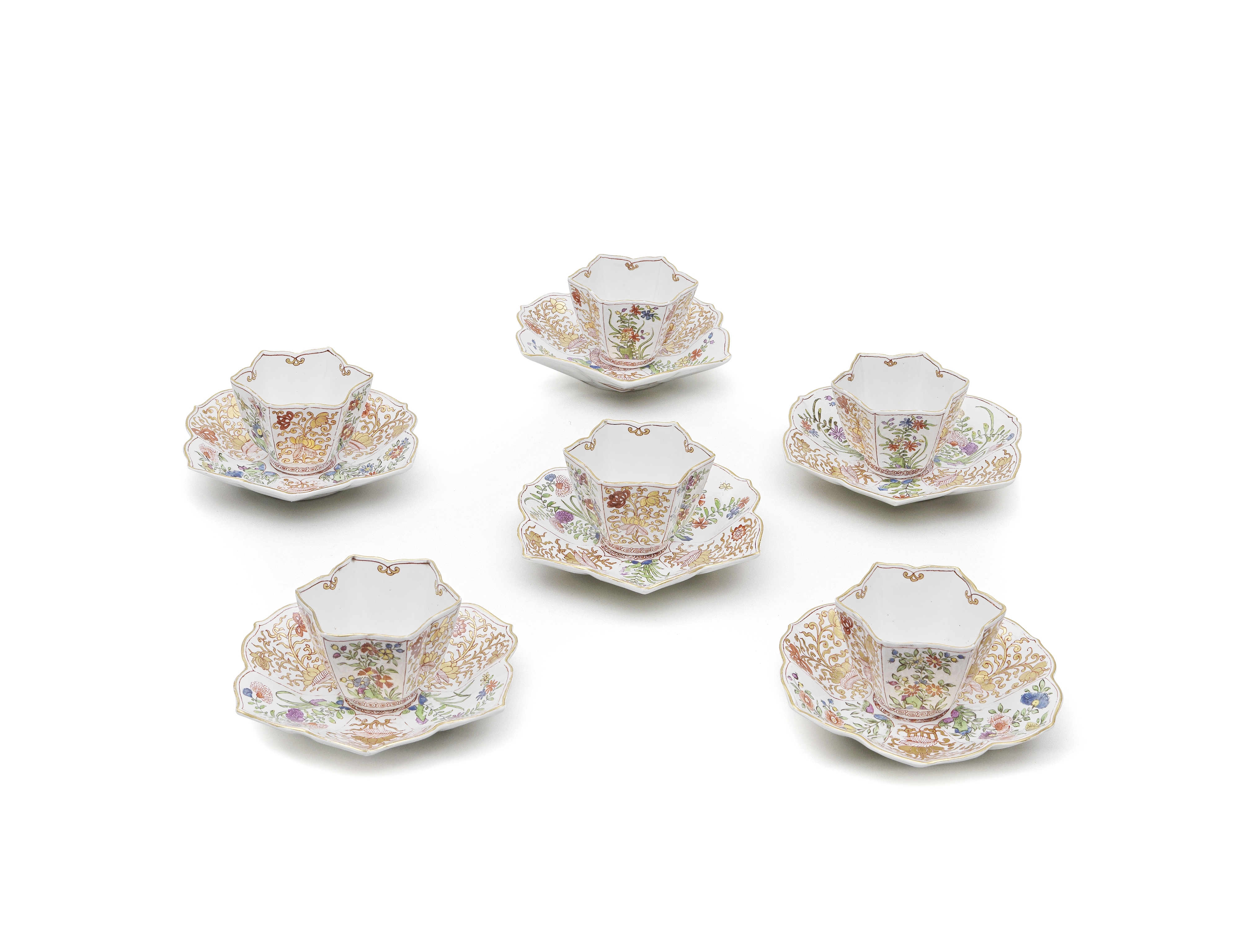 A rare set of six Vienna hexafoil teabowls and saucers, circa 1745-50