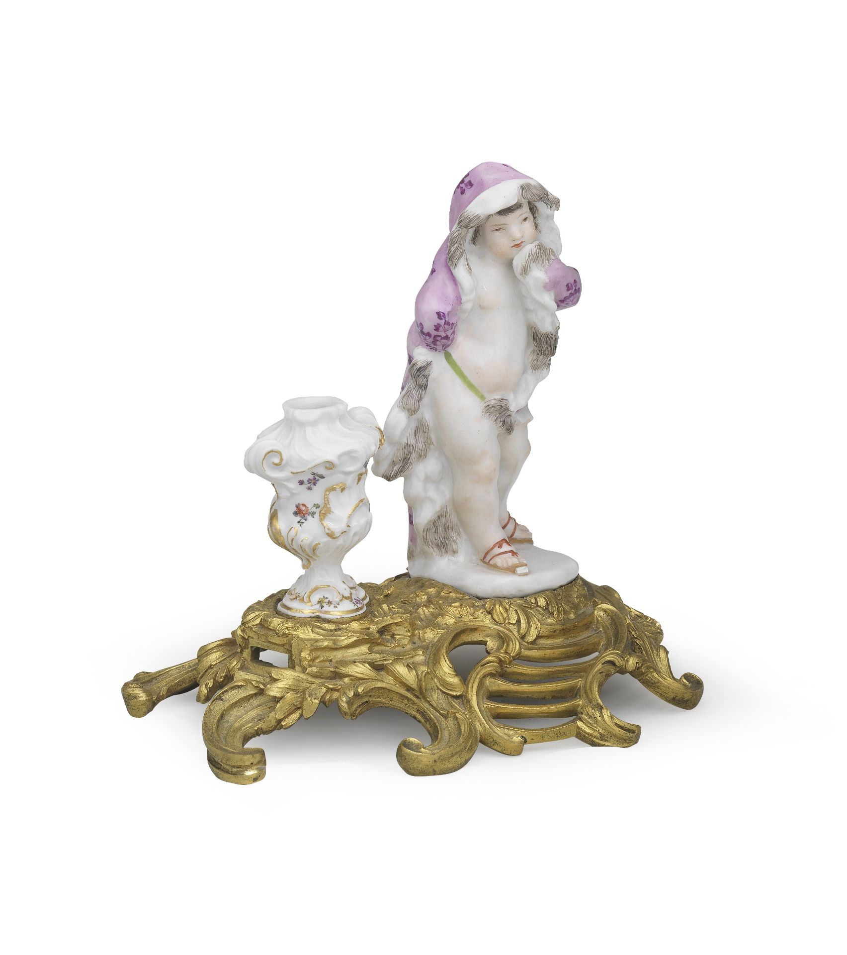 An ormolu-mounted figure of a Meissen putto emblematic of Winter, mid 18th century