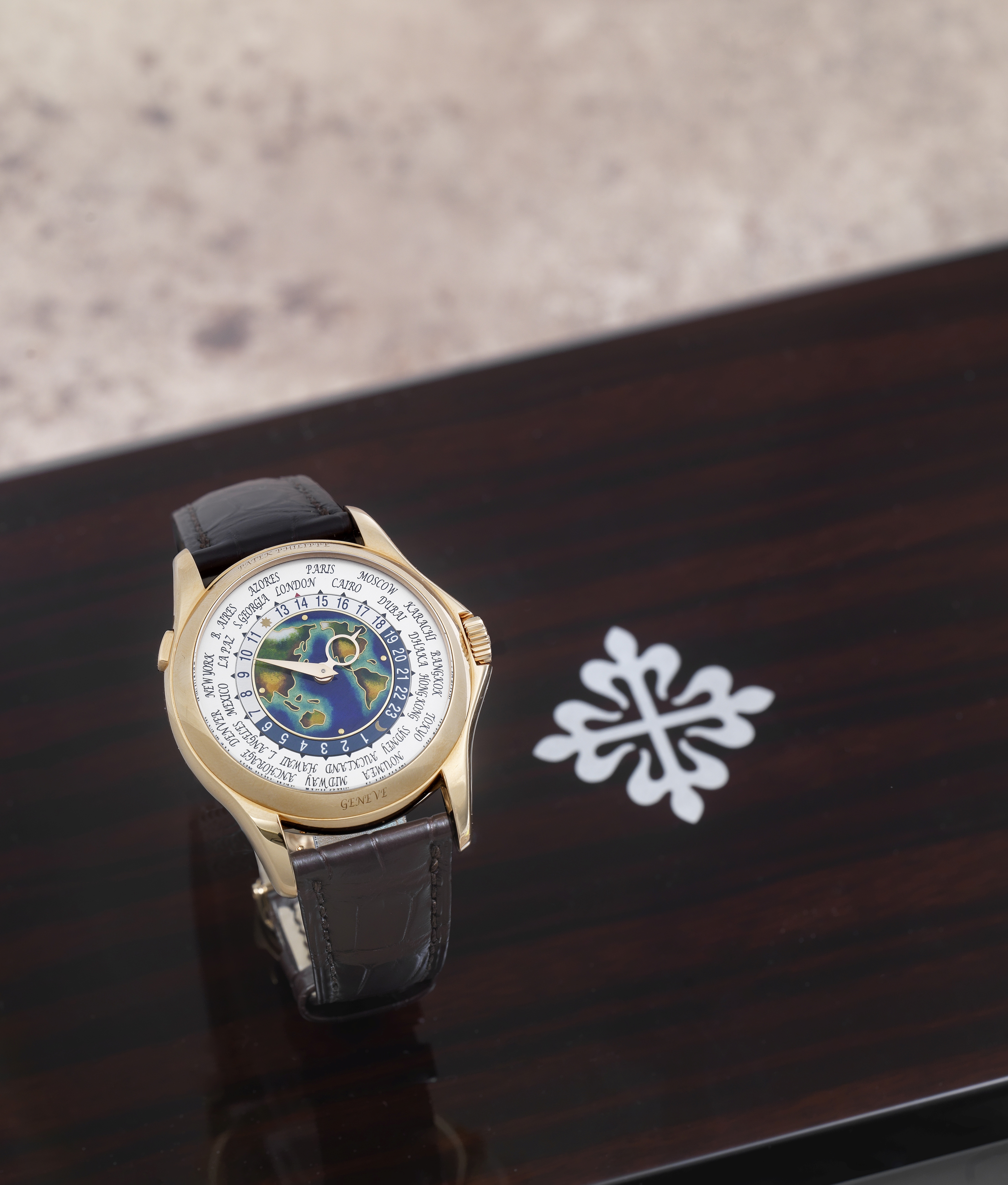 Patek Philippe. A fine and rare 18K rose gold automatic wristwatch with world time indication and...