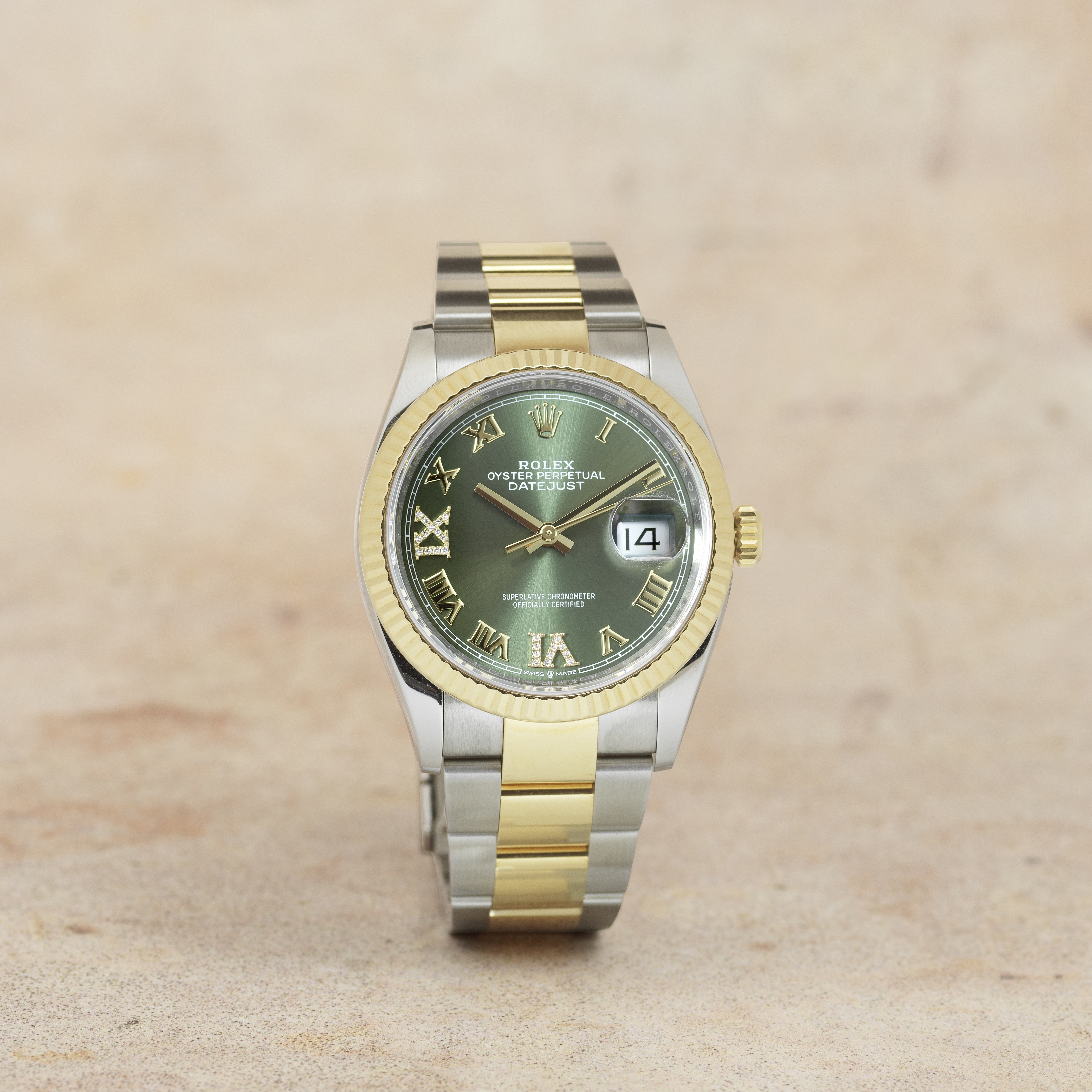 Rolex. A stainless steel and 18K gold automatic calendar bracelet watch with diamond set olive di...