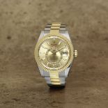 Rolex. A stainless steel and 18K gold automatic annual calendar bracelet watch with dual time zon...