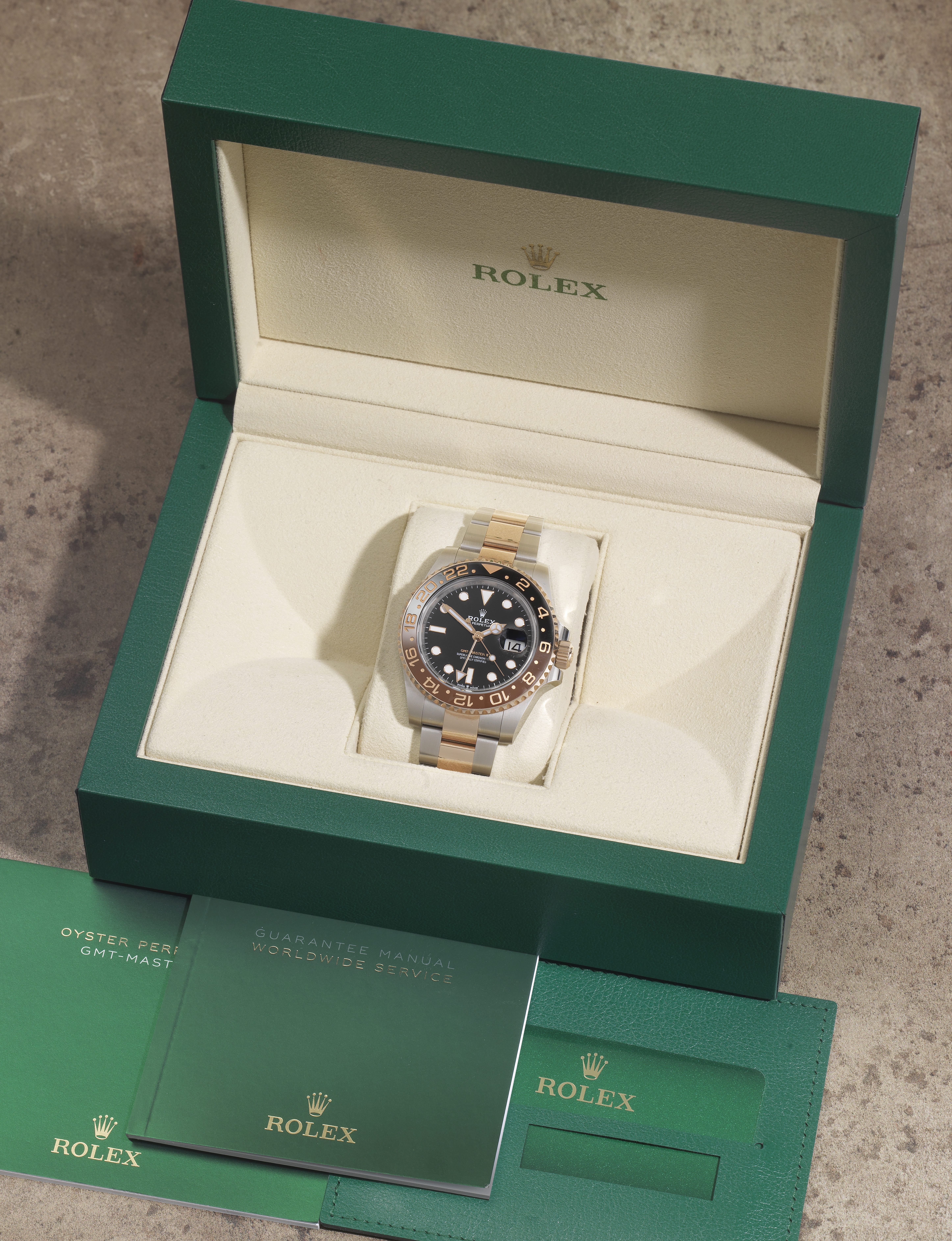 Rolex. A stainless steel and 18K rose gold automatic calendar bracelet watch with dual time zone ...