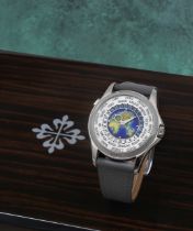 Patek Philippe. A fine 18K white gold automatic wristwatch with world time indication and polychr...