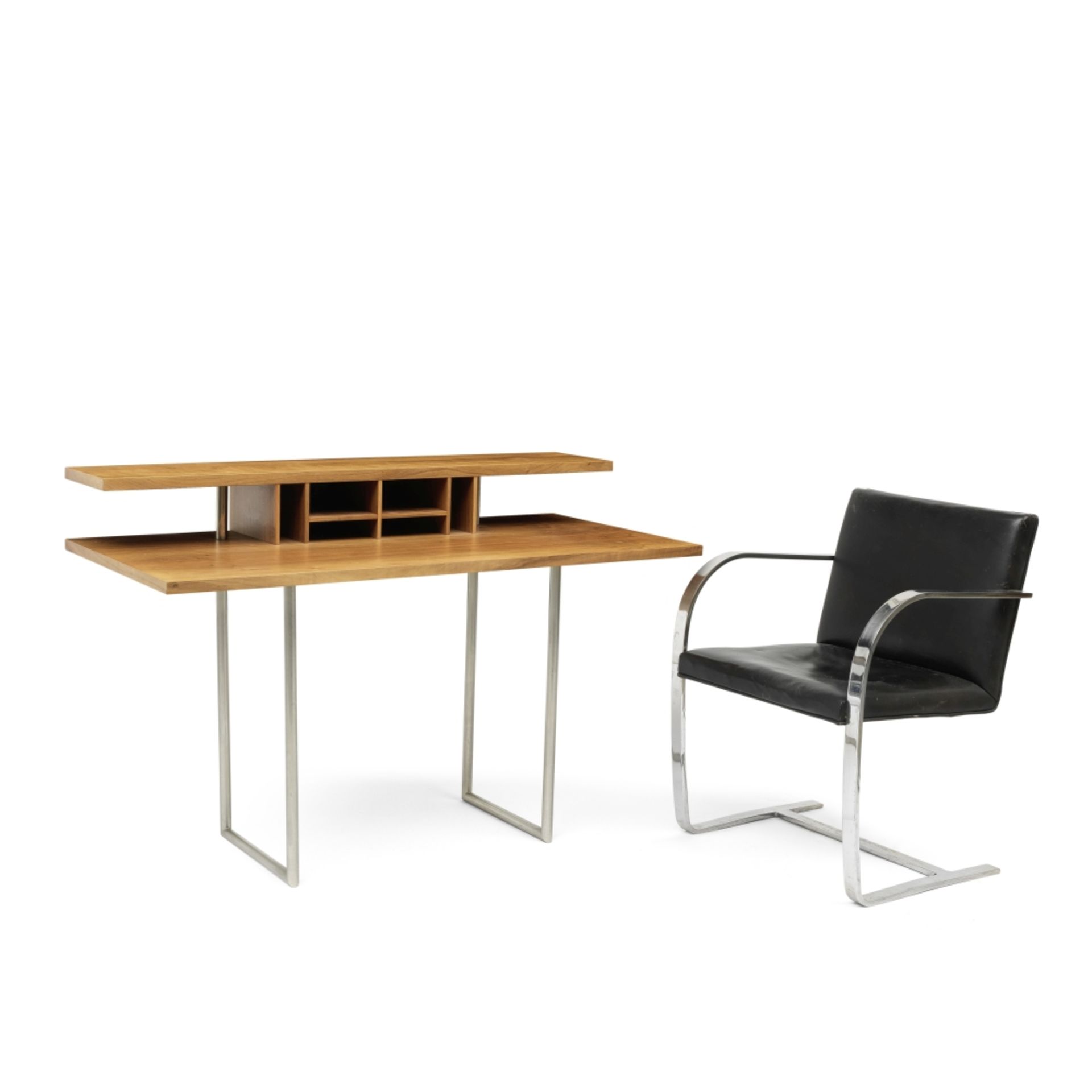 A walnut 'Eileen' desk designed by Sir Terence Conran, together with a black leather steel Brno a...