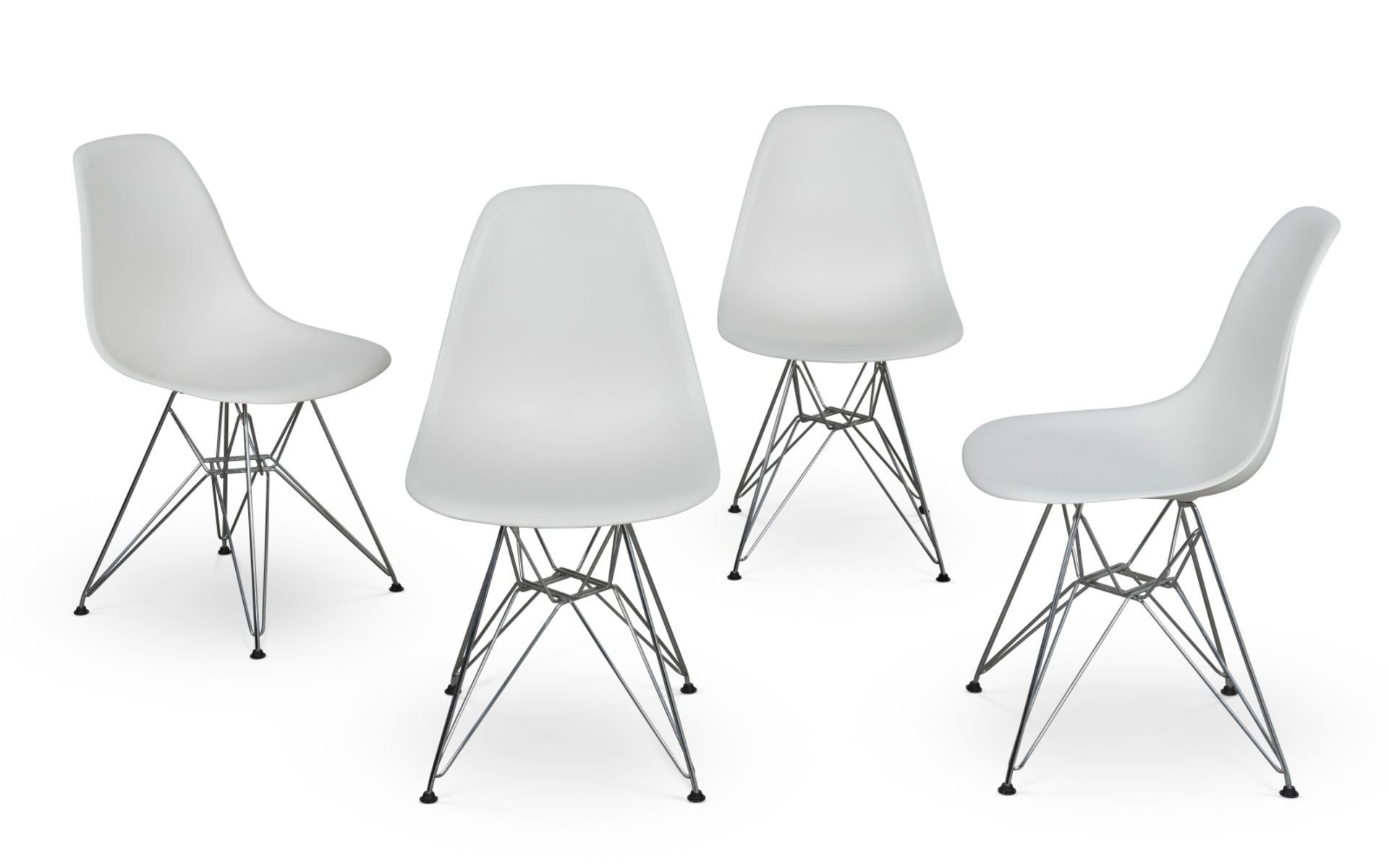 A set of four white 'DSR' side chairsDesigned by Charles and Ray Eames in 1950, produced by Vitra...