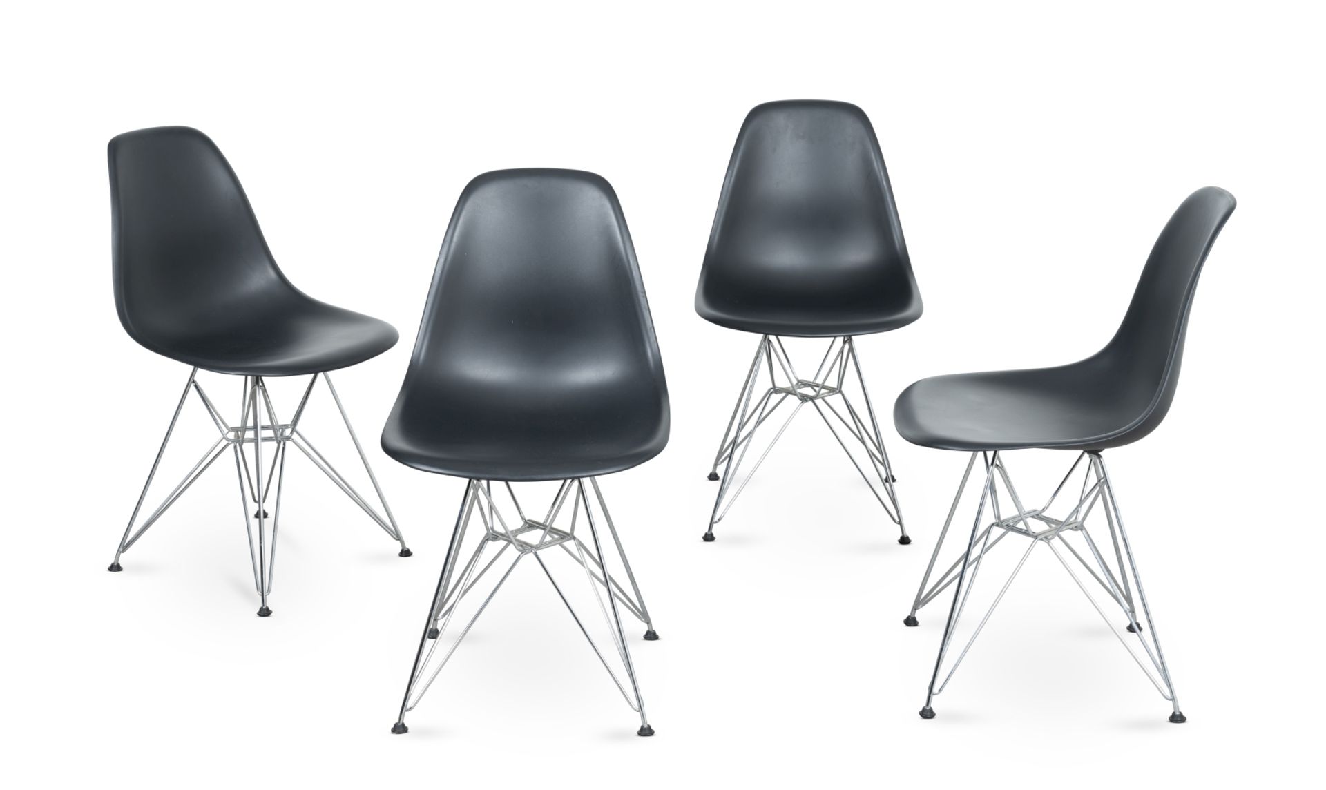 A set of four black 'DSR' side chairsDesigned by Charles and Ray Eames in 1950, produced by Vitra...