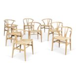 A set of eight CH24 'Wishbone' dining chairsDesigned by Hans J Wegner in 1949, manufactured by Ca...