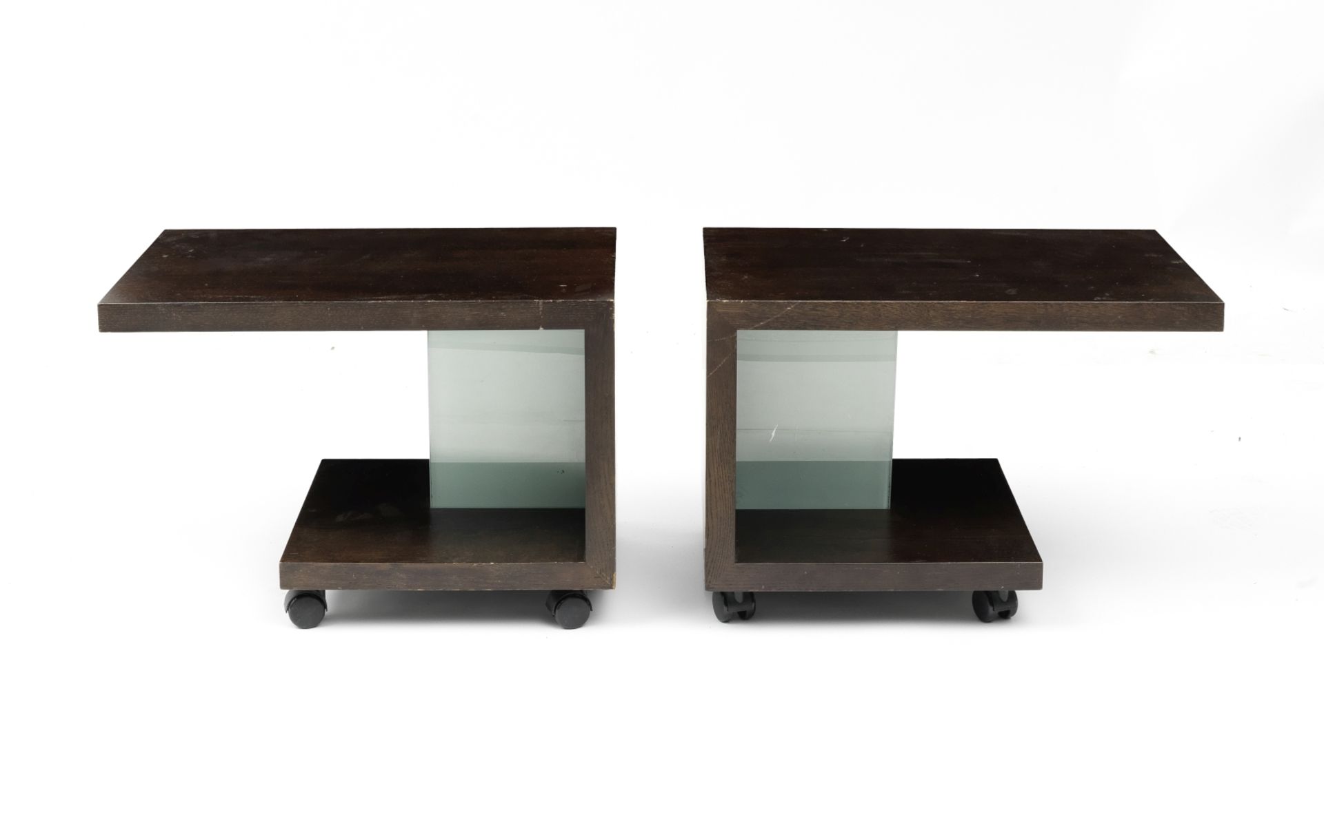 A pair of ebonised angular bedside tables Designed by Sir Terence Conran