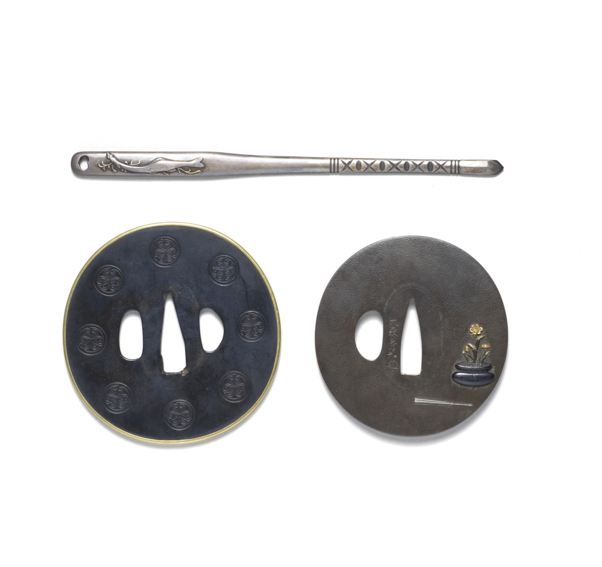TWO TSUBA (HAND GUARDS) AND A KOGAI (SKEWER) Edo period (1615-1868), early/mid-19th century (3)