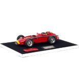 A 1:12 scale model of Juan Manuel Fangio's 1957 World Championship winning Maserati 250F, by Midl...