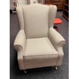 A Marks & Spencer contemporary gull wing arm chair.