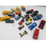 A mixed lot of play worn vehicles to include vintage by Lesney, Matchbox, Tri-Ang and Dinky and