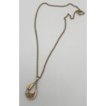 A Ladies 9ct gold floral design pendant with a 9ct gold necklace. [7.97grams]