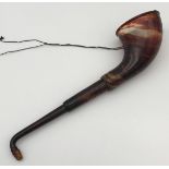 An early 20th century Telescoping ear trumpet in a faux tortoise shell.