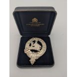An Edinburgh silver clan brooch produced by Hamilton & Inches. [5.5cm]