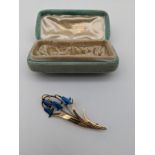 Antique 9ct gold and enamel flower design brooch. [4.59grams] [6.5cm]