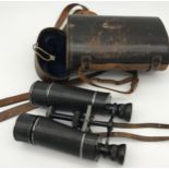 A Pair of antique binoculars produced by Busch No.84444 Terlux 12x with leather carry case.