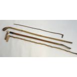 A Lot of four various antique walking canes and riding crops.