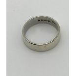 A 9ct white gold wedding band. [Ring size O] [4.02grams]