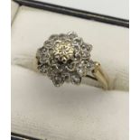 A Ladies 9ct yellow gold and diamond cluster ring. [.25ct] [Ring size N] [3.22Grams]