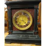 Antique slate mantle clock. Detailing brass face and roman numerals.