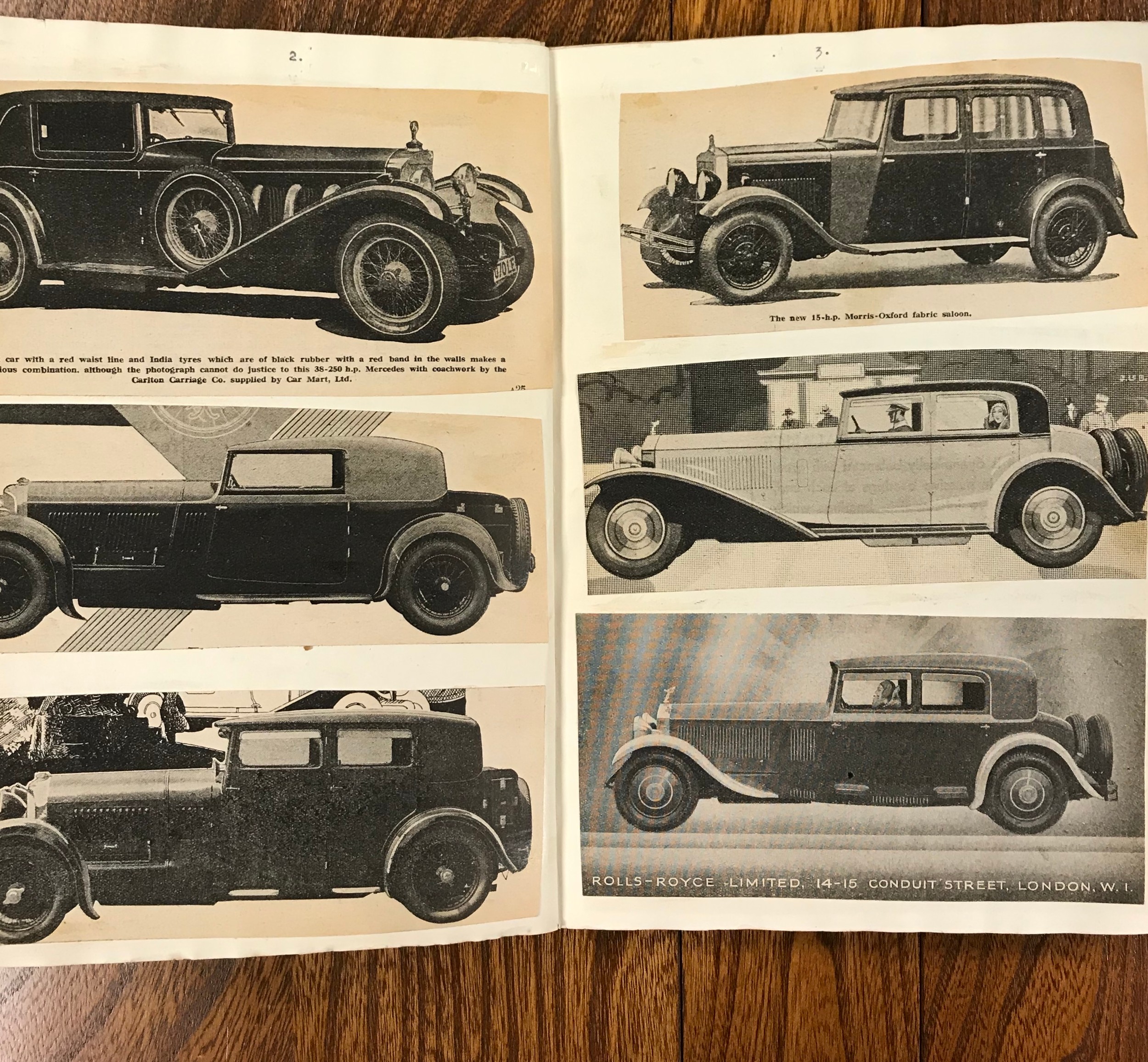 Vintage scrapbook containing cut outs of cars