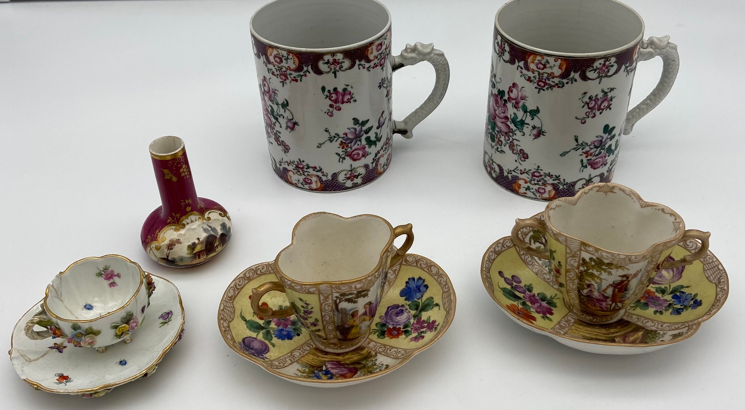 A Collection of antique porcelain to include two panel painted Meissen style loving cups with
