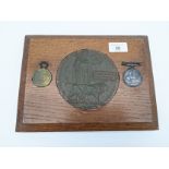 A WW1 Death plaque and medals belonging to Robert Edward Metheringham.