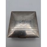 A Birmingham silver cigarette box. [9cmx8.5cm]