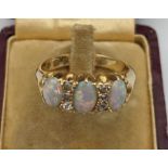 An Antique 18ct gold diamond and opal stone ladies ring. [Ring size Q] [5.79grams]