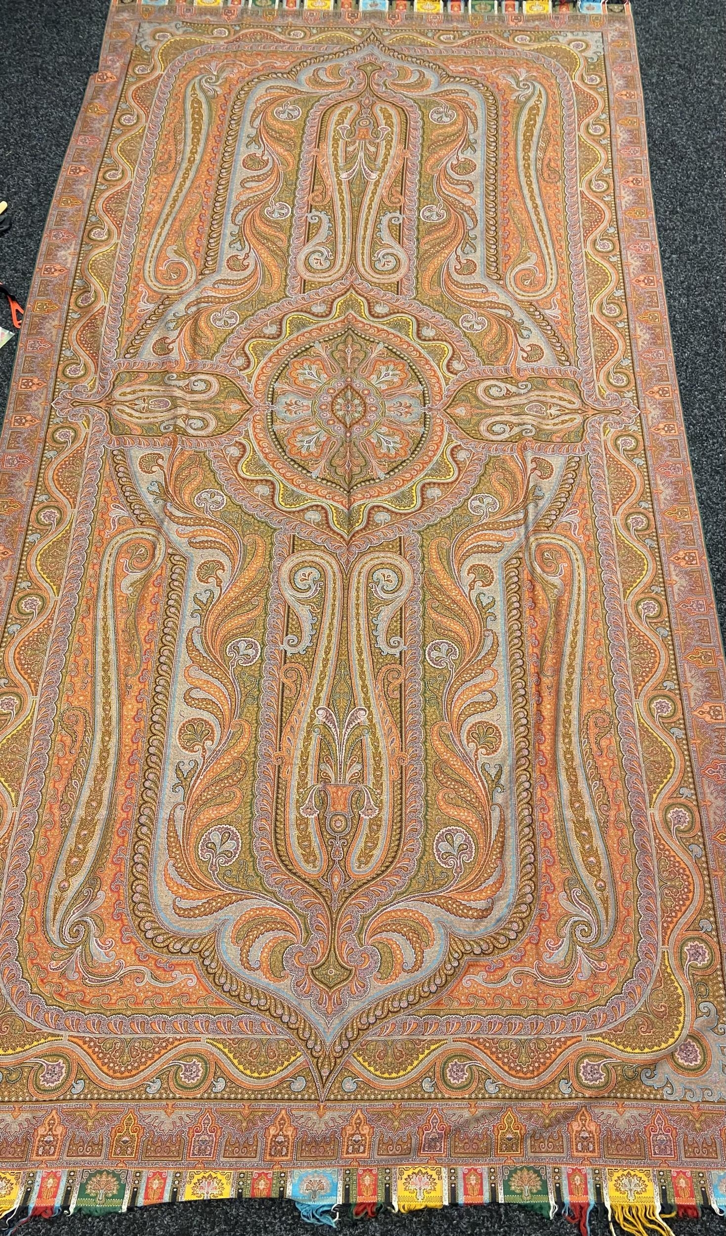 A Large Antique hand woven paisley shawl pattern rug/ wall hanger. [340x164cm]