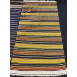 A Tribal/ middle East vibrant coloured rug. [234x120cm]