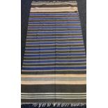 An Indian/ Persian hand woven rug. [241x124cm]