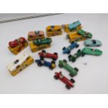 A collection of Dinky racing/sports vehicles, all play worn, some with boxes