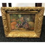 A Late 19th century oil painting depicting still life grapes and vines. Fitted with a heavy