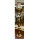 Antique ornate brass and glass paraffin lamp. Comes with an acid etched art nouveau shade. 83cm in