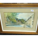 Original watercolour depicting street scene signed P Gillanders. Fitted with a heavy oak frame. [