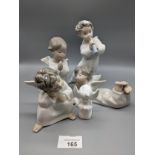 Four Lladro figurines, together with another