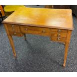 Georgian desk, the rectangular top above a central drawer flanked by short drawers, raised on square