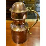 A 19th century Copper Tappit Hen stein, fitted with a copper coin to the lid. Brass handle. [27cm in