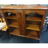 20th Century burr walnut display cabinet, the rounded rectangular top above a central panel